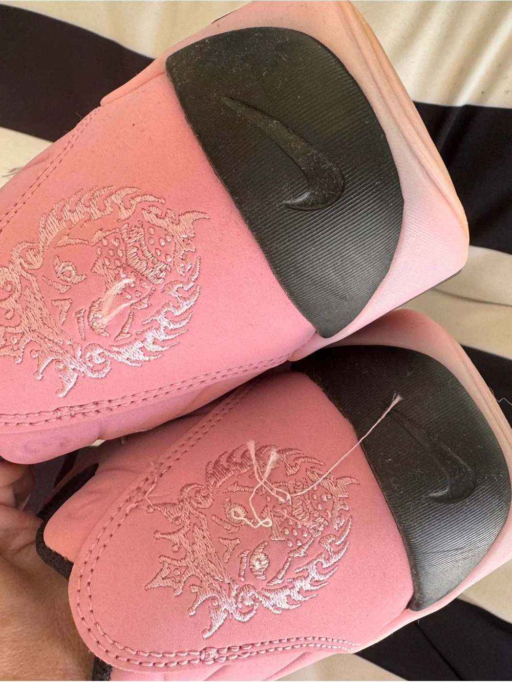 Nike Pink and Black basketball sneaker with White Swoosh